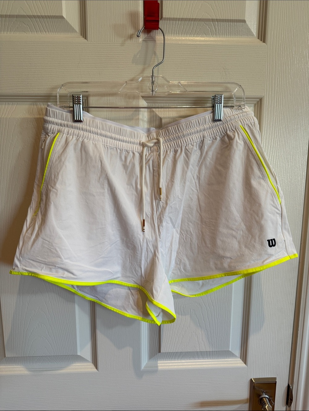 Wilson Women’s White Athletic Shorts with Neon Yellow Trim. Never worn.